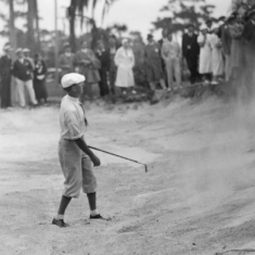 Willie Macfarlane, watching his ball after hitting out of the bunker on the last hole during the 1933 Gasparilla Open Golf Championship payed in Tampa, Florida.  Macfarlene lost by one stroke to Denny Shute, in extra holes.(Copyright Unknown/USGA Museum)