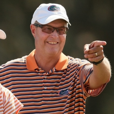 Windermere, FL--10/26/10--Florida coach Buddy Alexander points to Bank Vongvanij at No. 18 on Tuesday during the final round of the Isleworth Collegiate Invitational.--(Photo by Tracy Wilcox/GOLFWEEK)